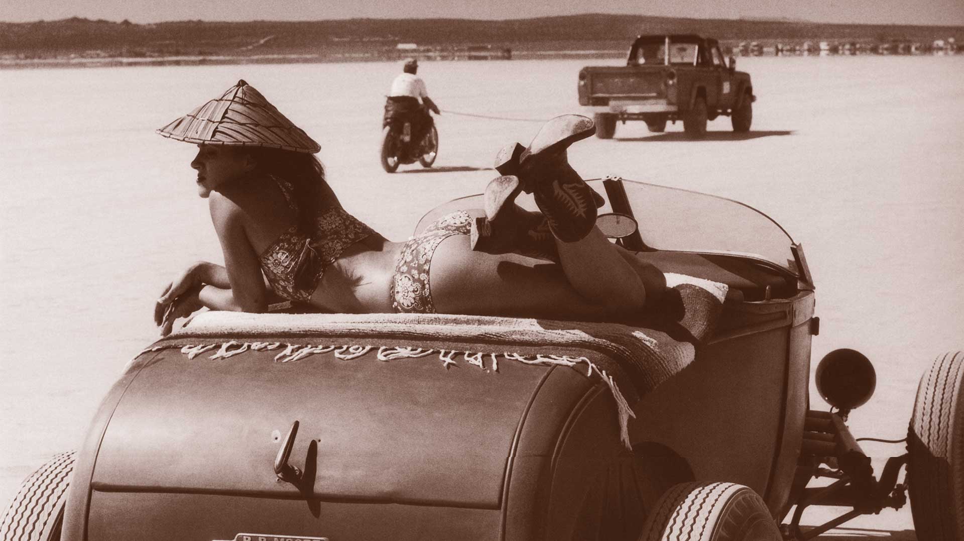 Image of woman laying across a hot rot in the Bonneville Salt Flats